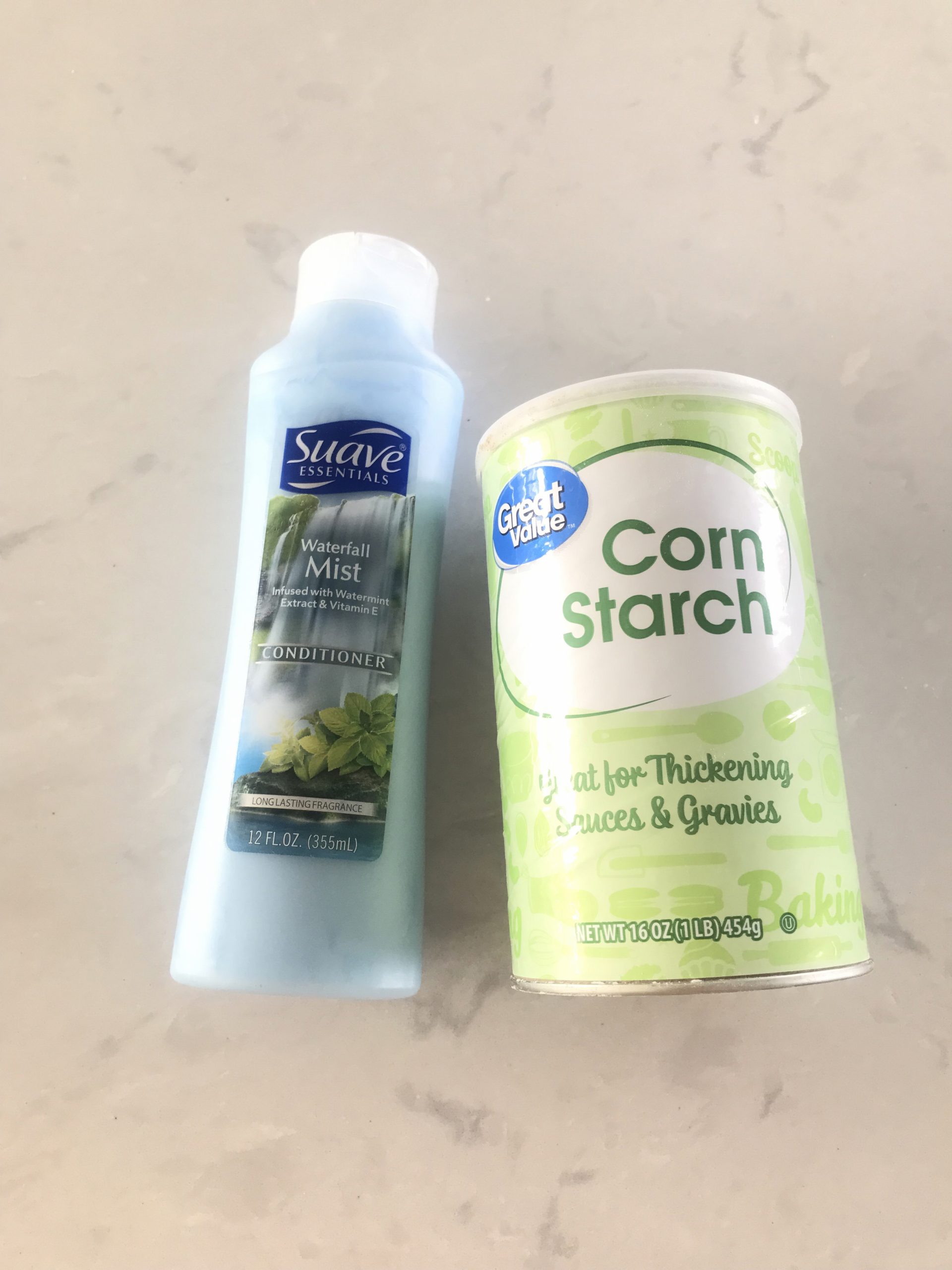 hair conditioner and cornstarch on countertop