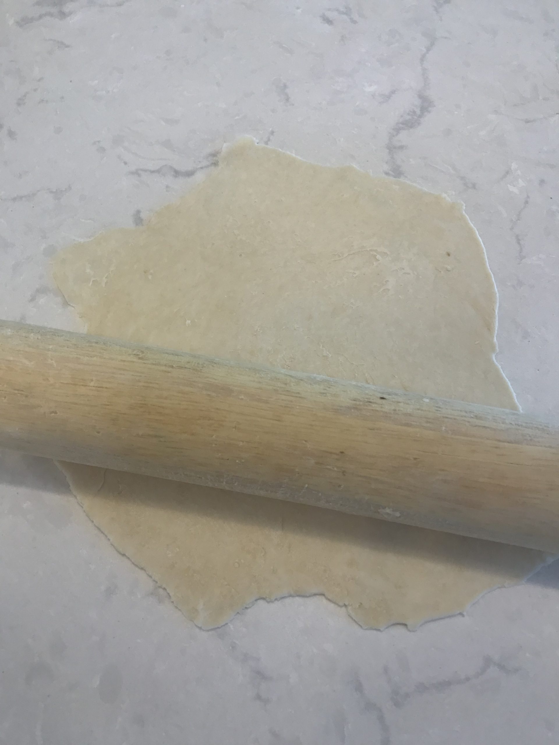 flour tortilla and rolling pin