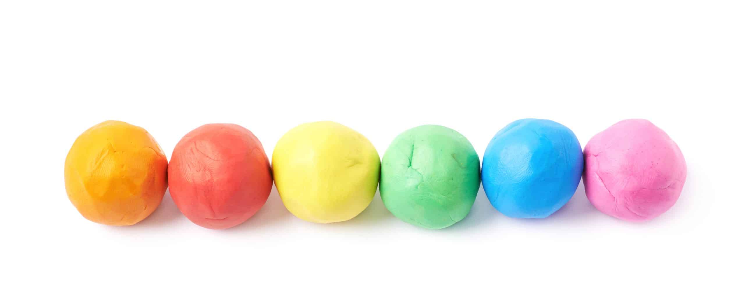 Lined up plasticine balls isolated